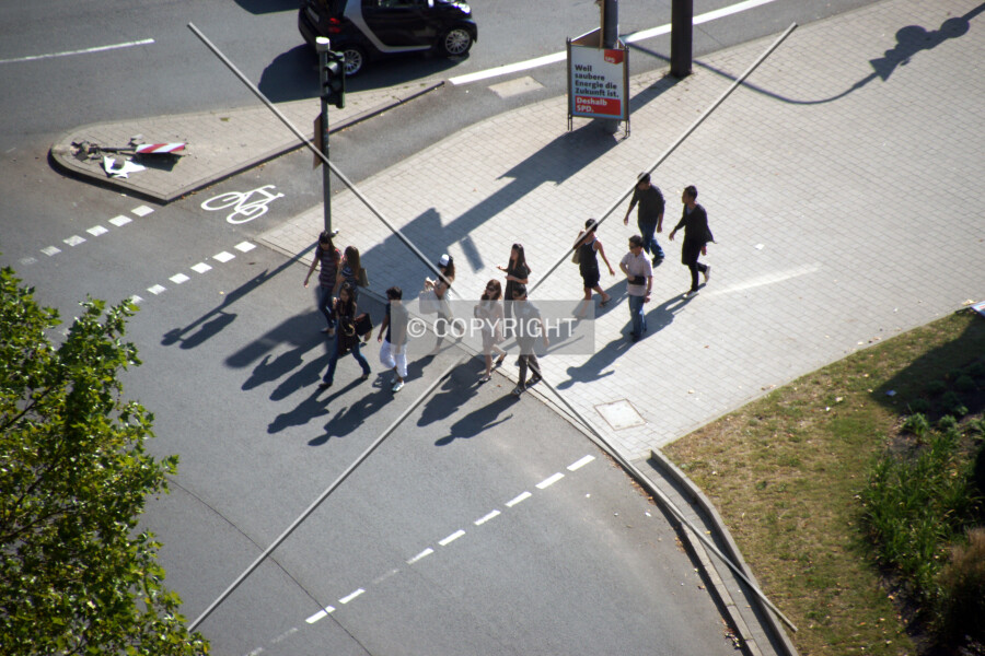 A crowd is pathing the street