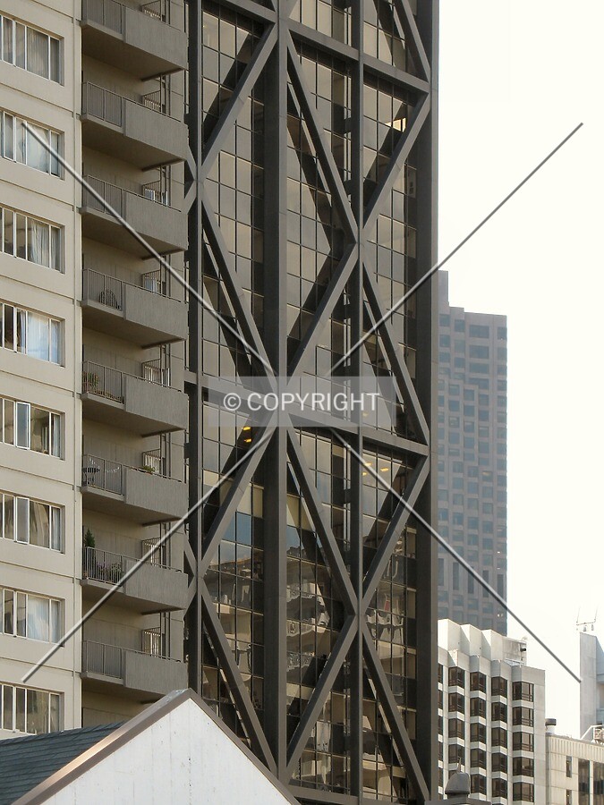 Exposed trusses from Jackson Street, partly obscured by Buckelew House