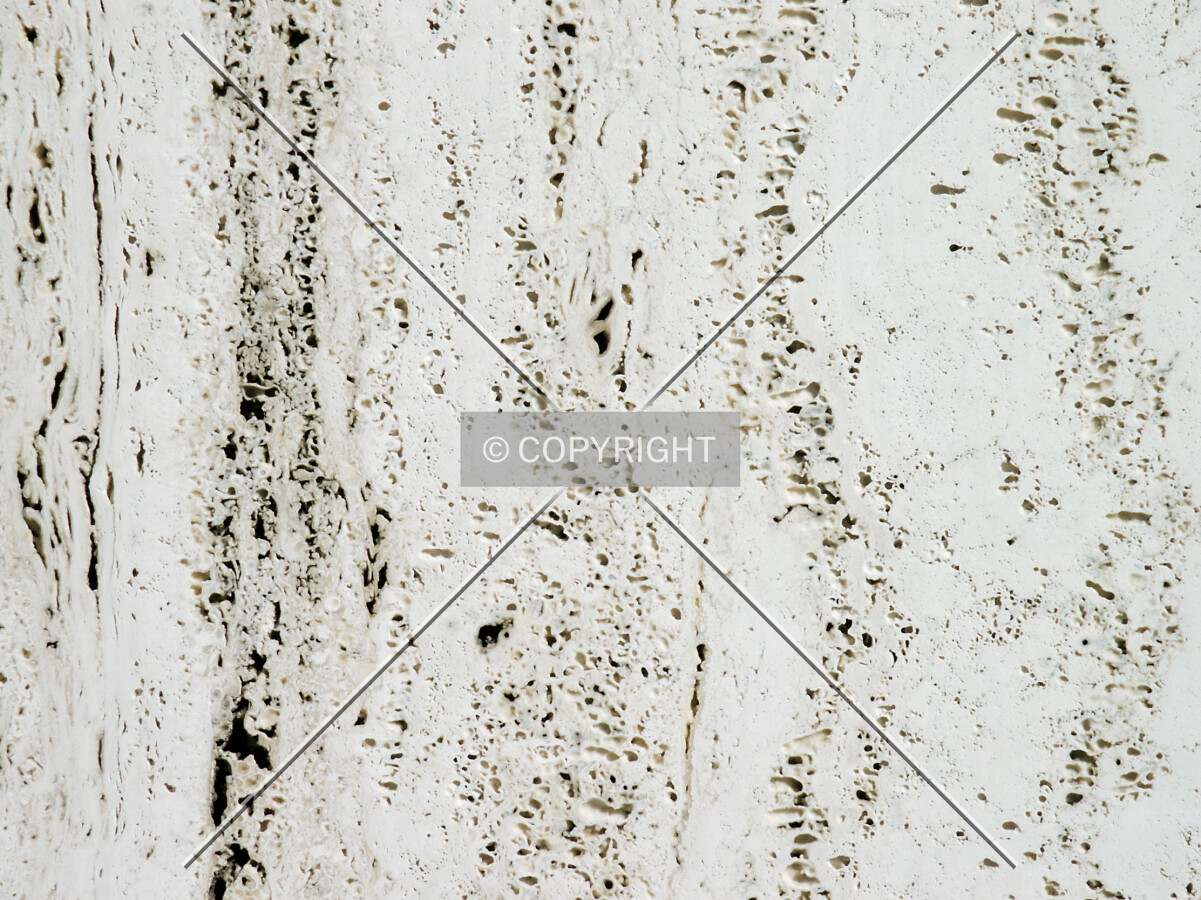 Close-up of the travertine facade