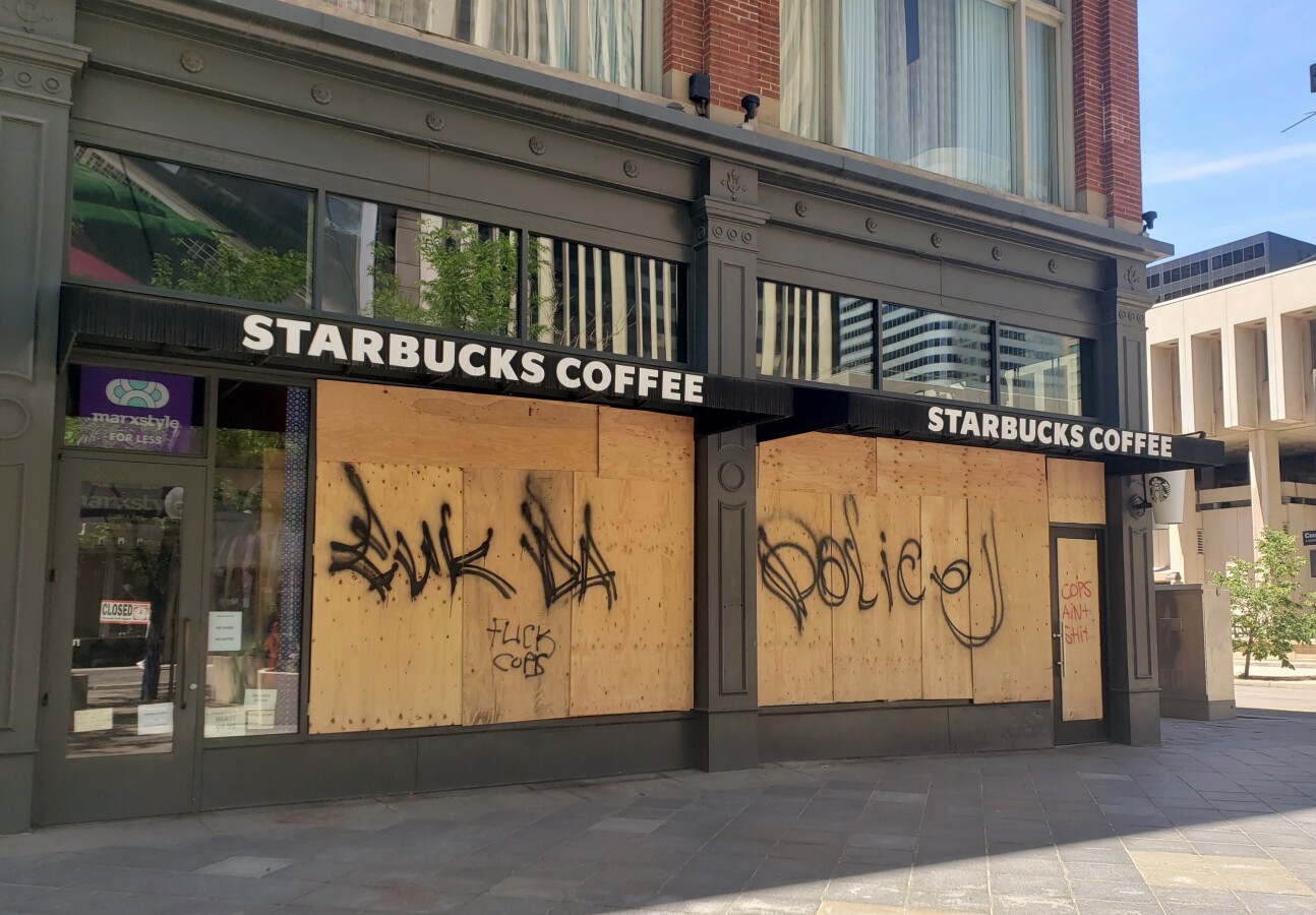 Windows boarded up after a protest got out of control