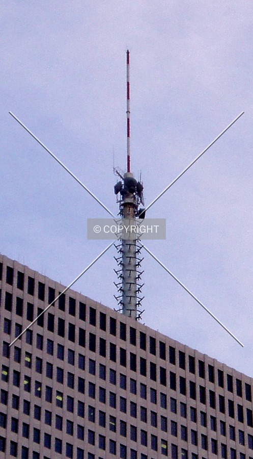 The enormous communications antenna on top of the building