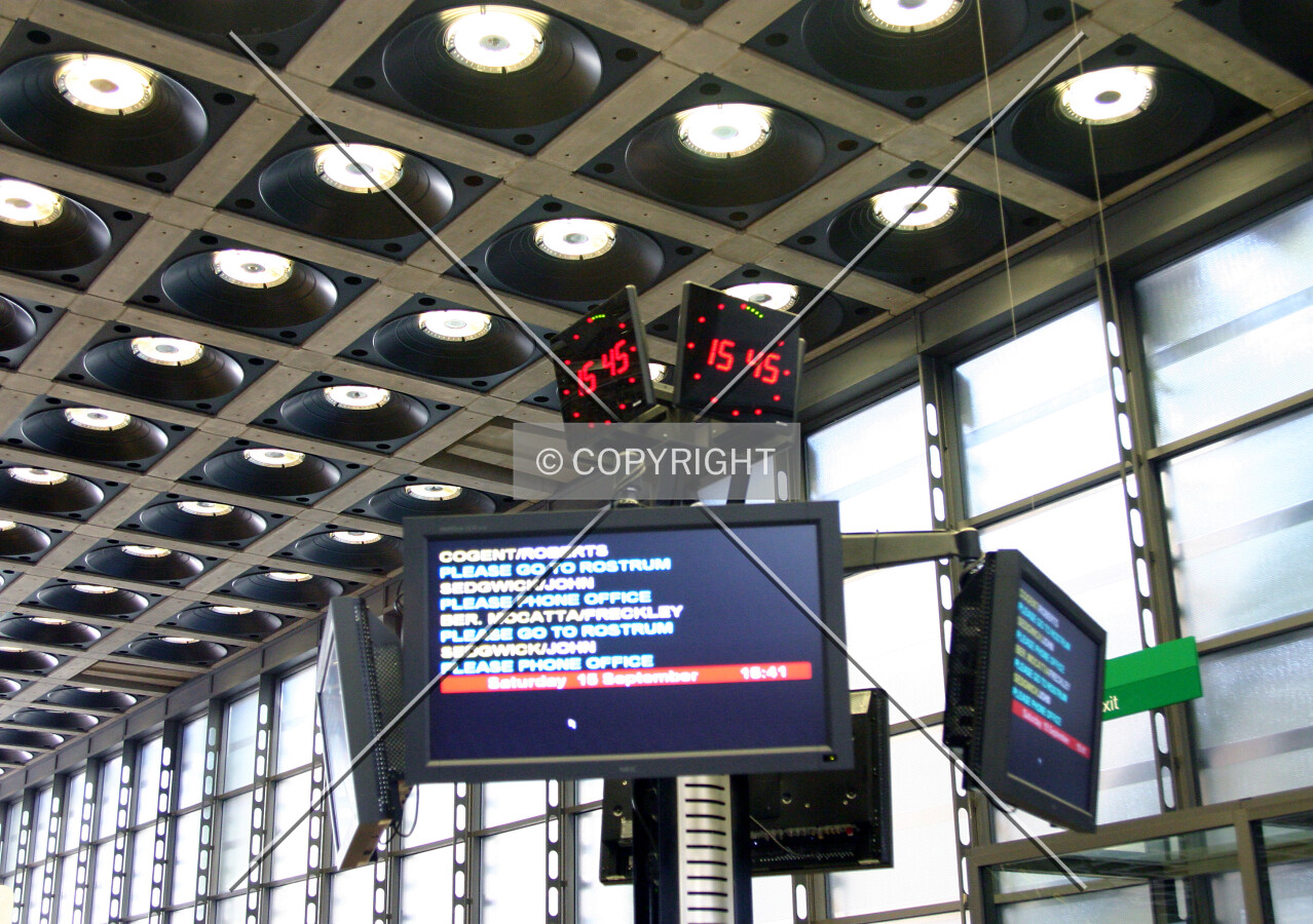 Typical brokerage floor with information displays and visually arresting clocks