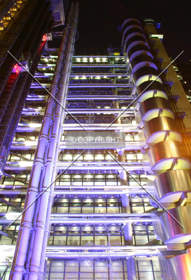 The north façade at night, illuminated in customary blue