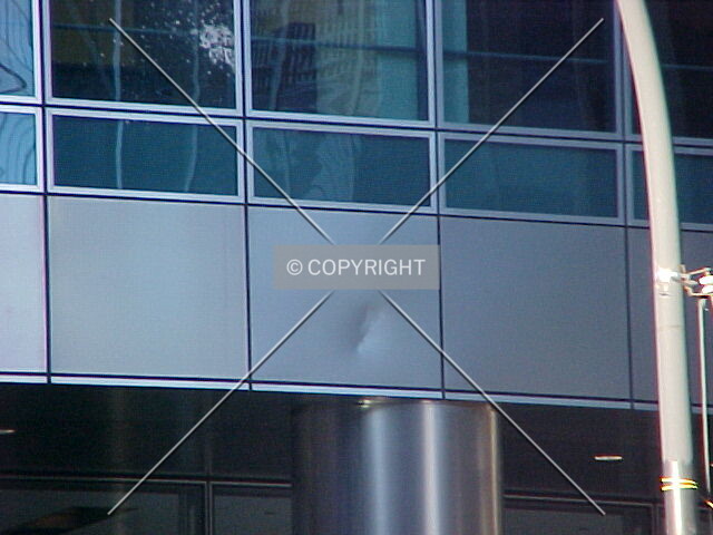 A dented metal panel on the southern facade