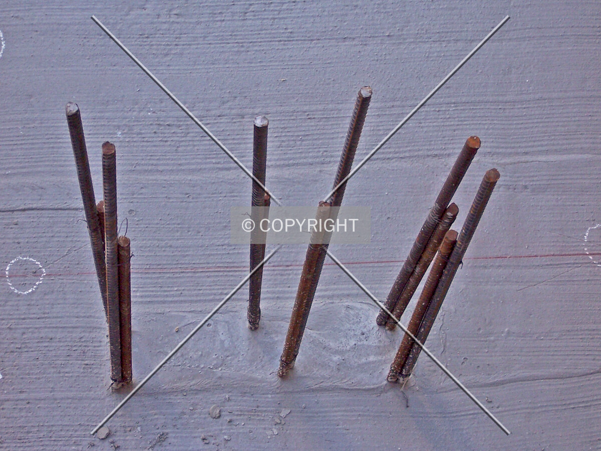 Column rebar piercing through a parking garage floor slab