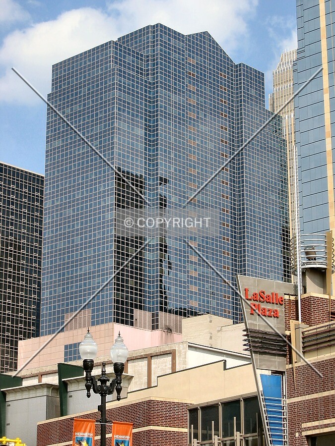 Upper floors rising above Hennepin Avenue signage