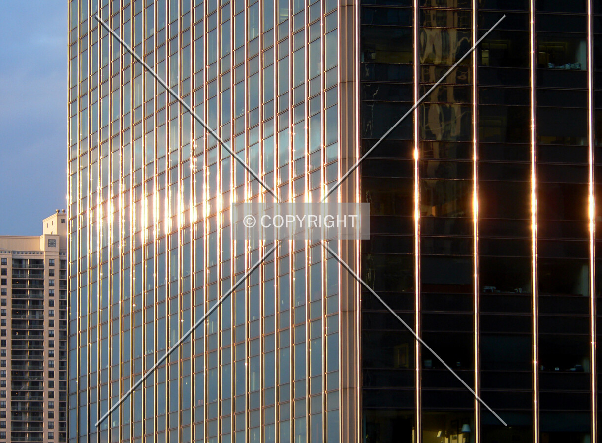 Sun reflecting off the mullions of the west facade