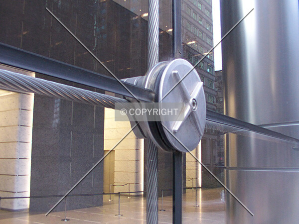 Close-up of the glass wall, showing one of the medallions