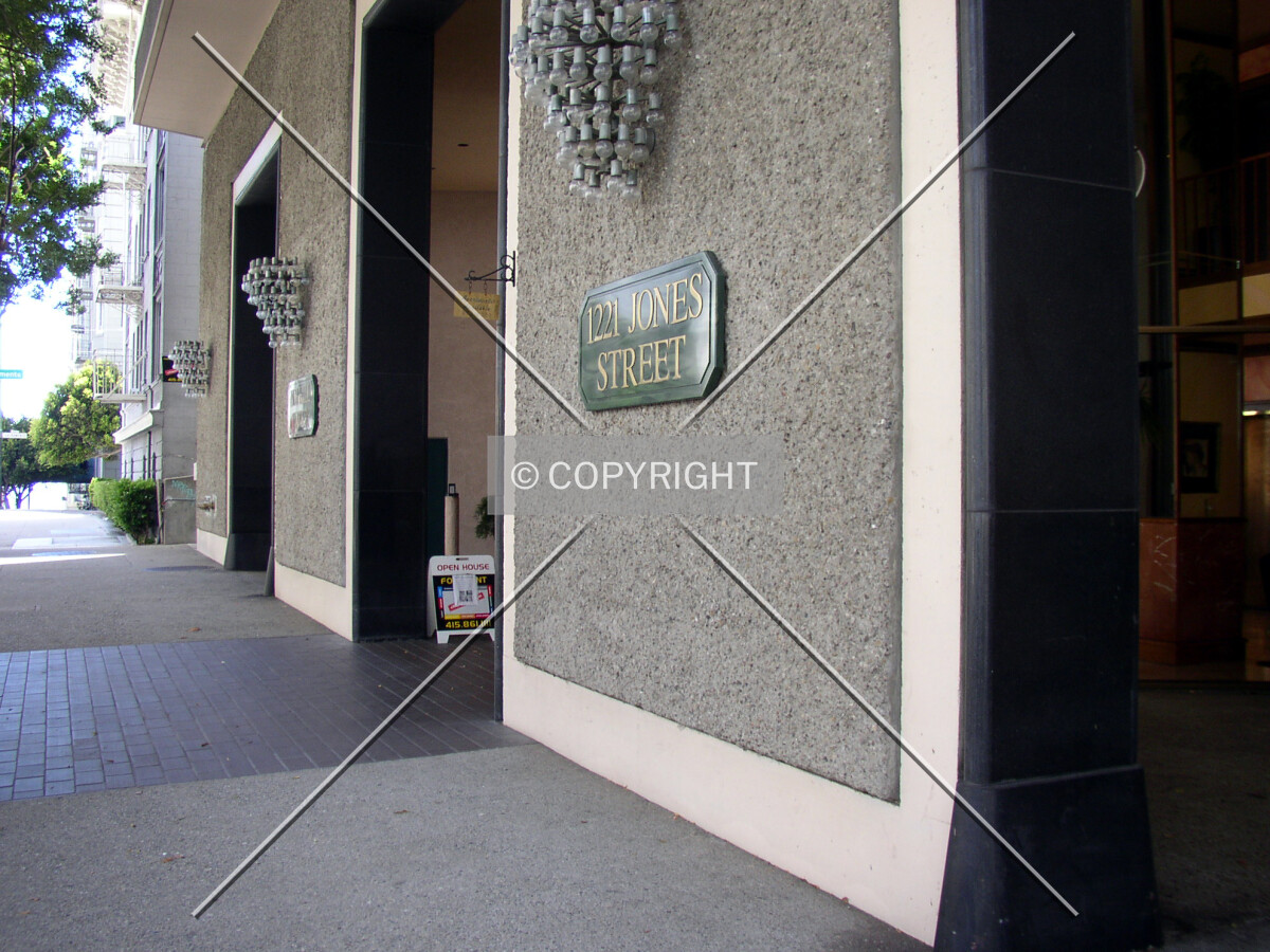 Signage at the building’s base along Jones Street