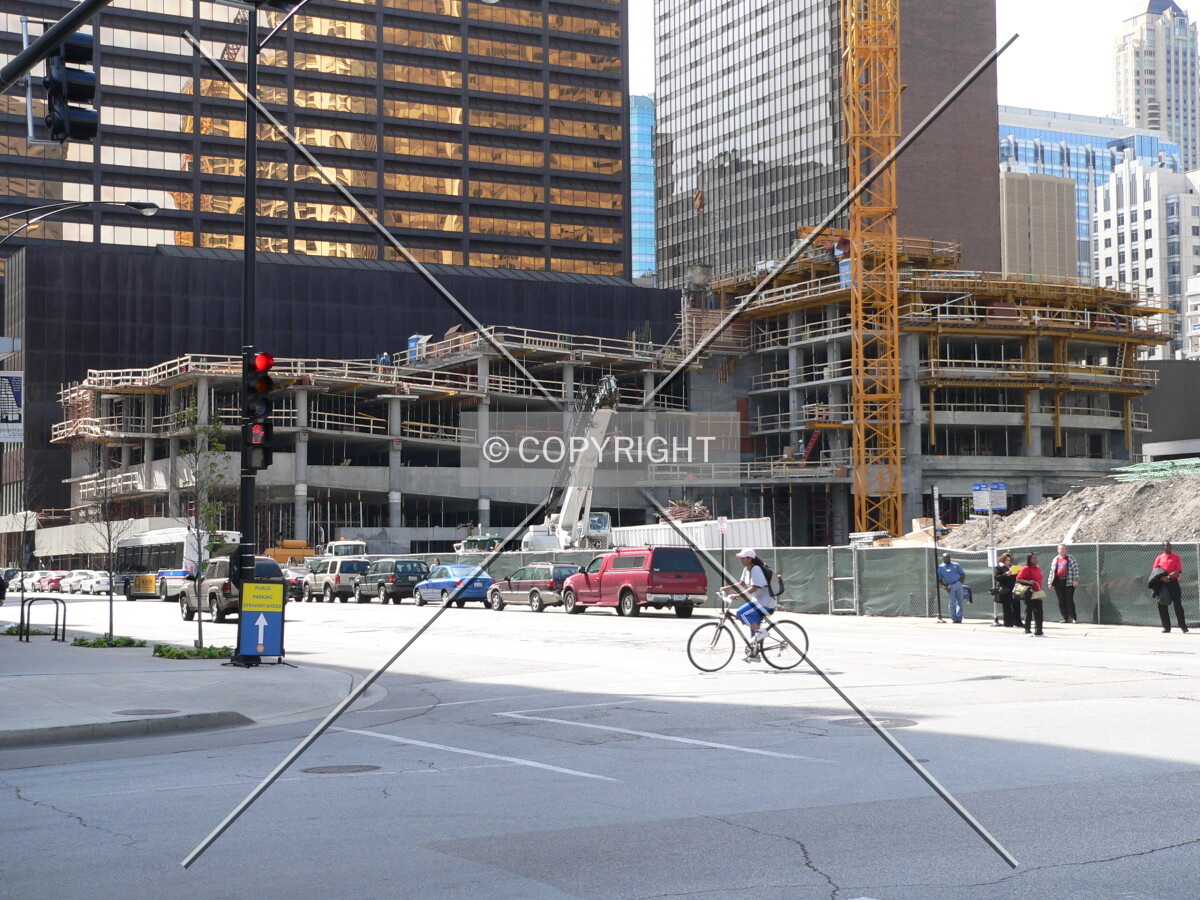 Looking northwest at the construction site across the intersection of McClurg Court and Grand Avenue