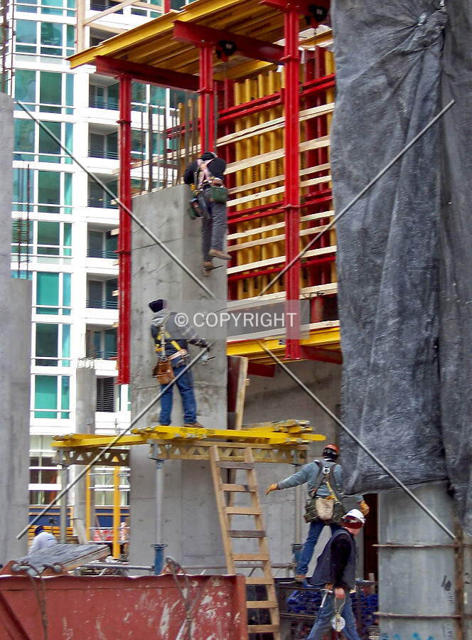 Workers on a column, just to the south of the core which is wrapped in concrete formwork