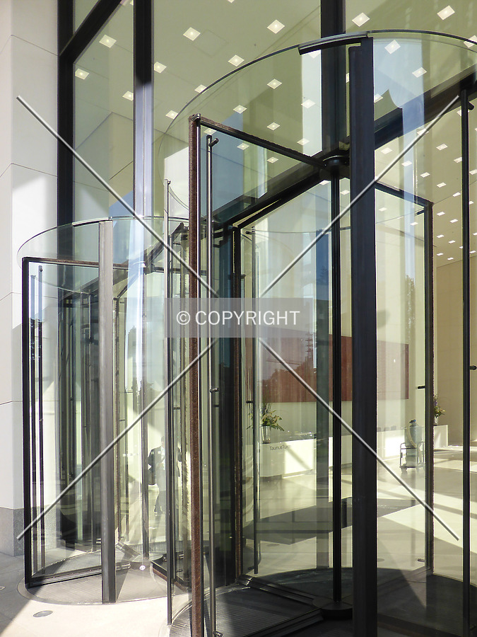 Revolving glass door