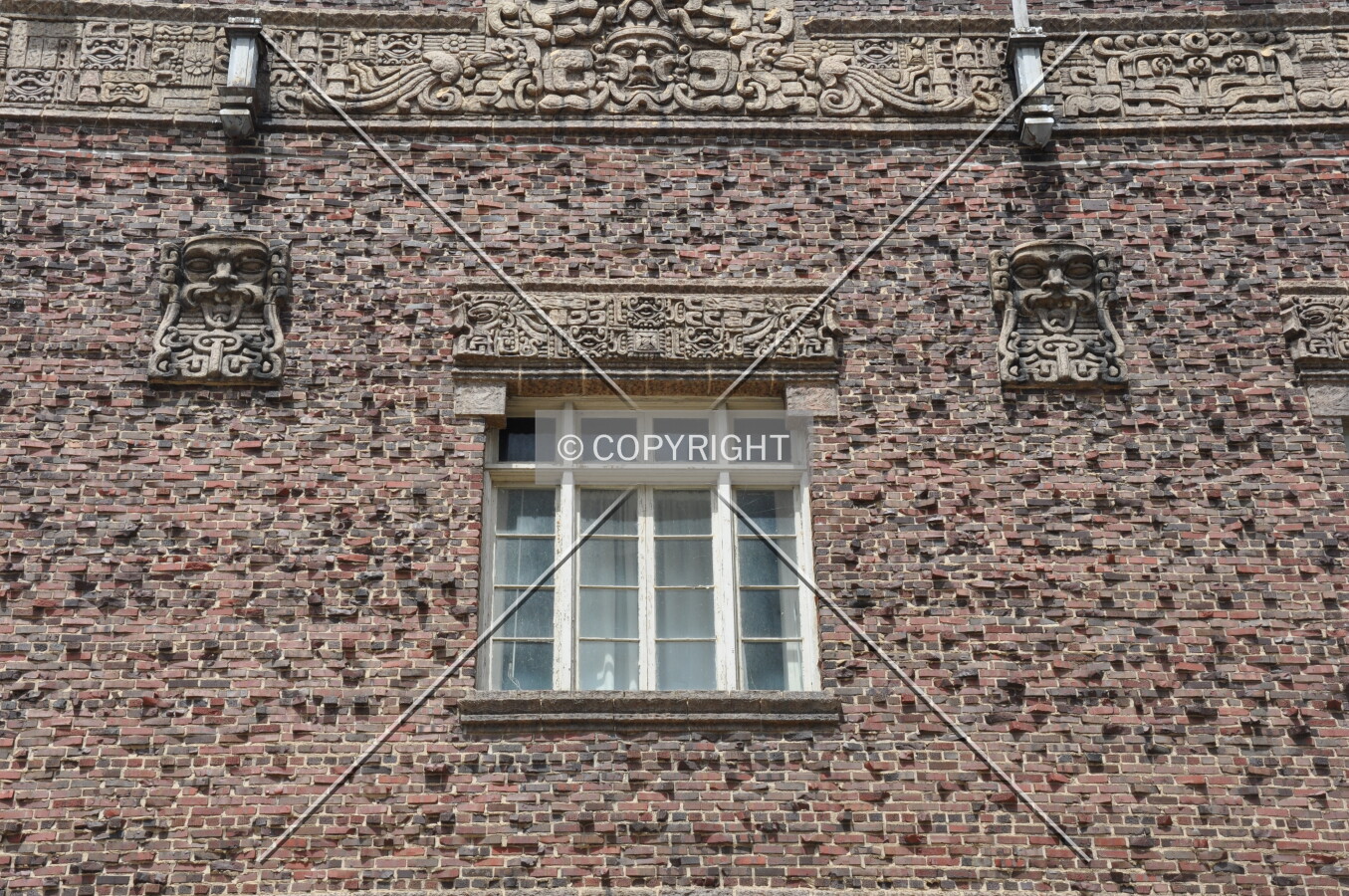 Detail of terra cotta lintel and masks