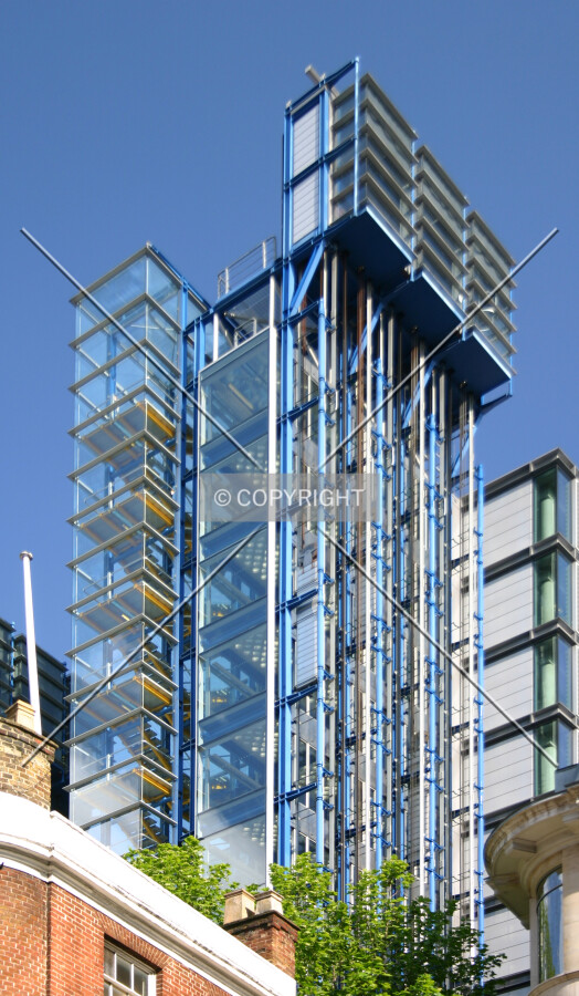 Looking up at the glazed stairwell, expressed in the typical style of architect Richard Rogers