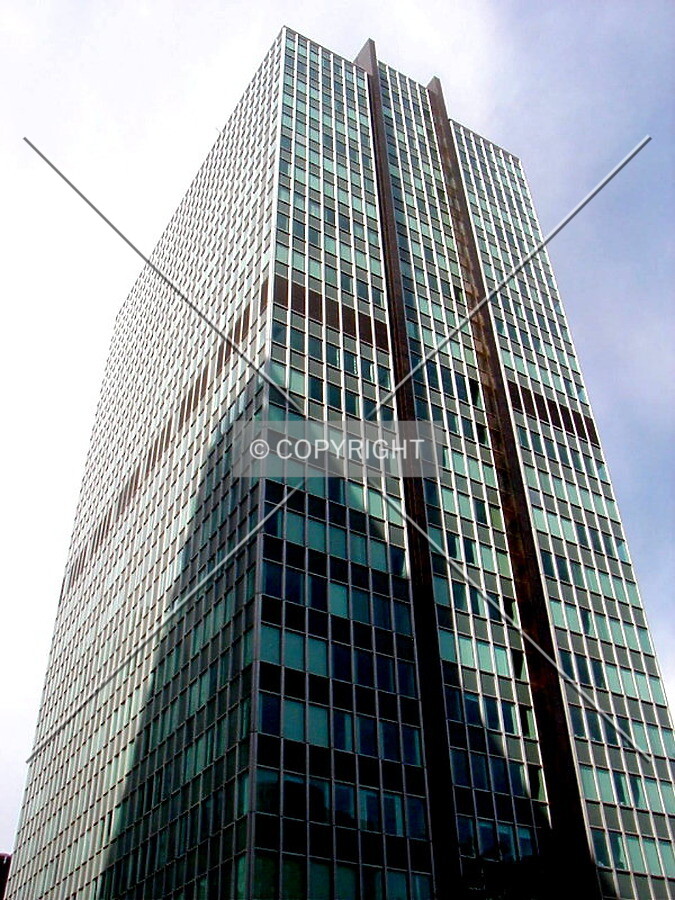 Guinness Tower in shadow of new 401 Burrard across Hastings Street