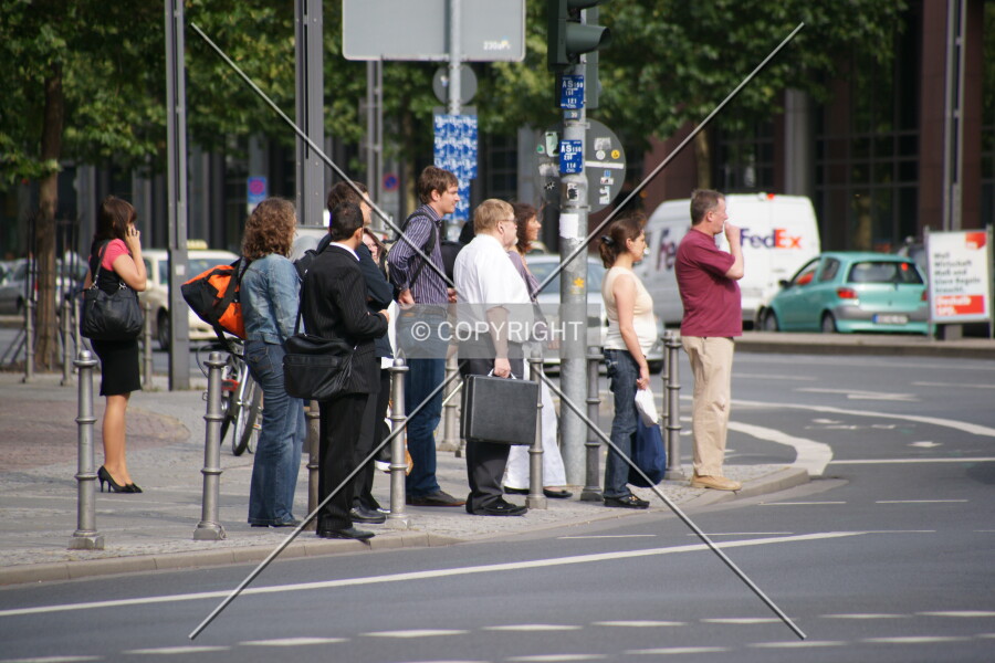 Crowd standing at traffic lights