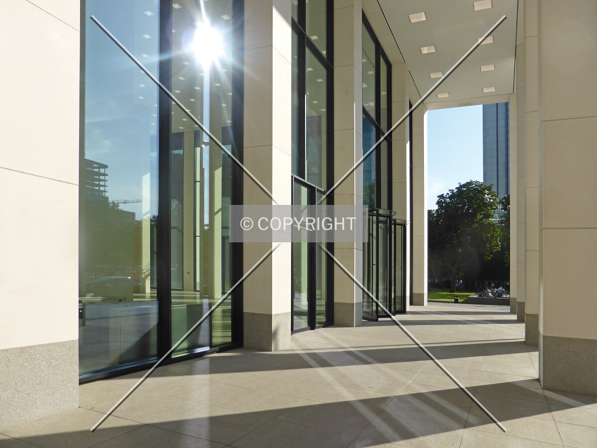 Sheltered sidewalk in front of the entrance