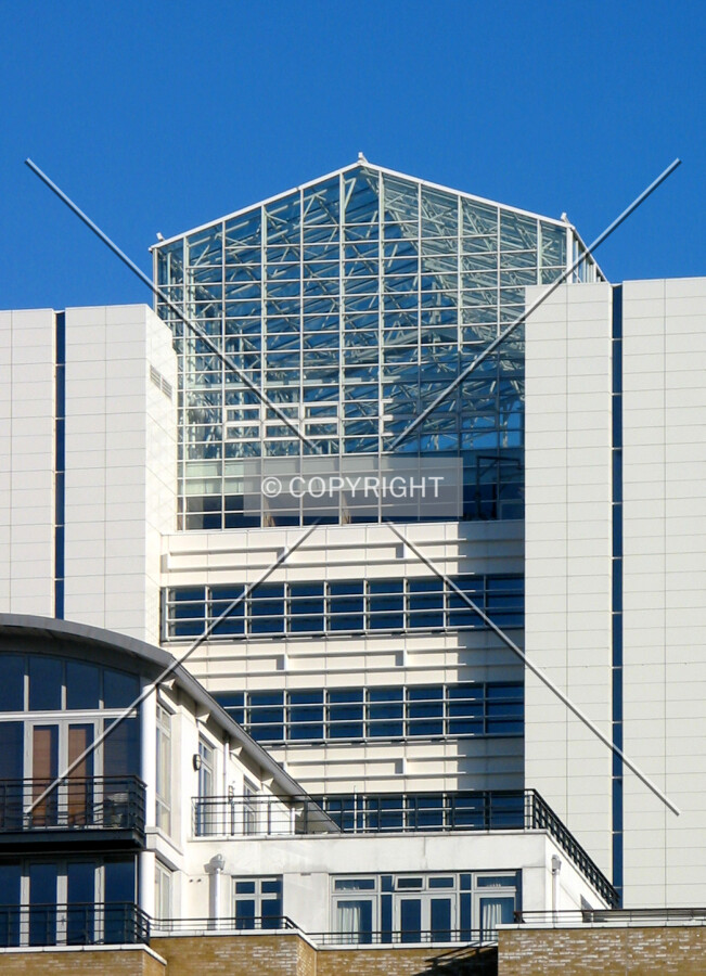 Detailed view of the glass enclosure at the tower's crown