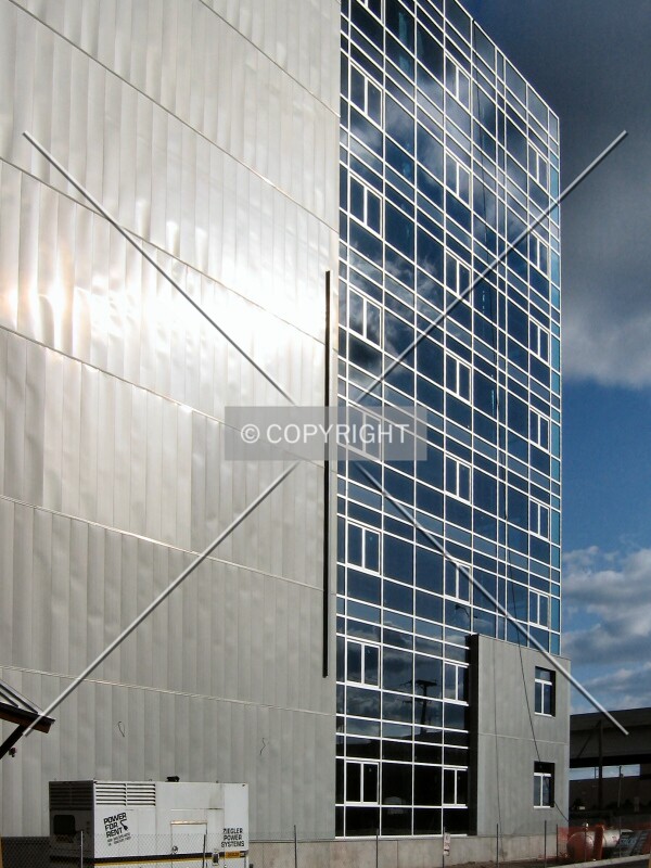 Sun glinting off the zinc facade