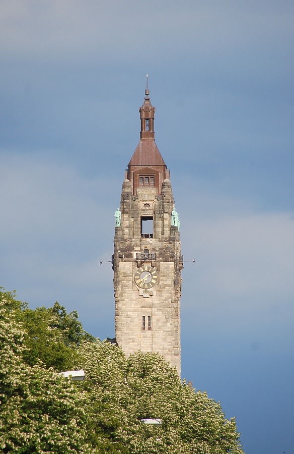 The tower of the Rathaus rising against the dark clouds