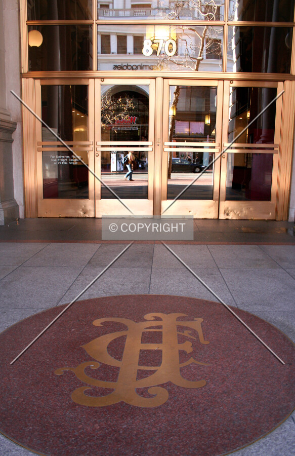 Main entrance with initials in the sidewalk