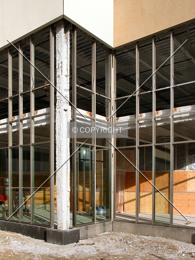 Partial glass installation on south corner
