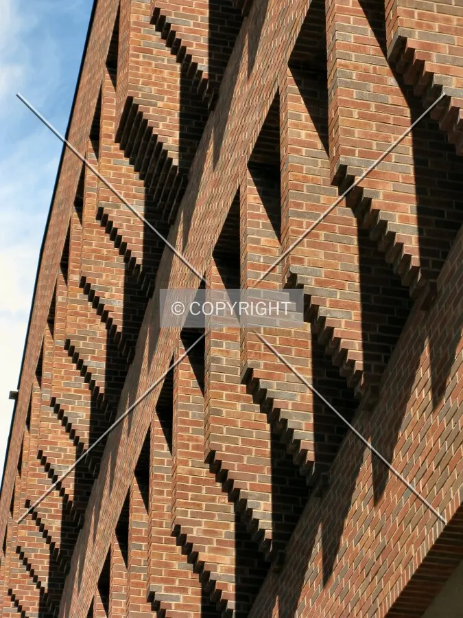 Scalloped profile with brickwork on upper levels