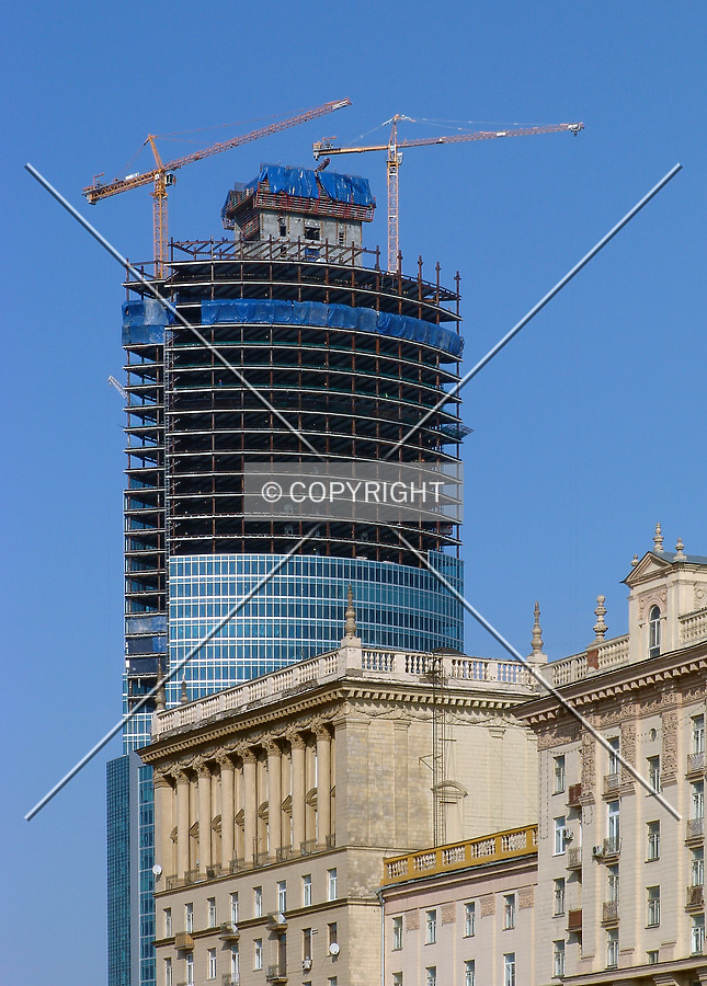 Towering over neighboring buildings