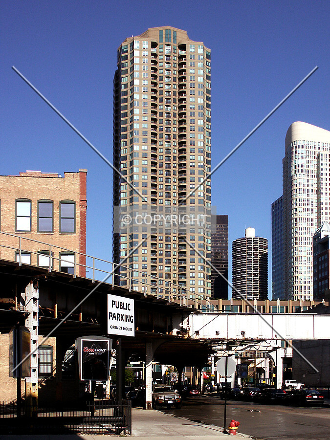 West facade over the el tracks from the corner of Hubbard and Franklin