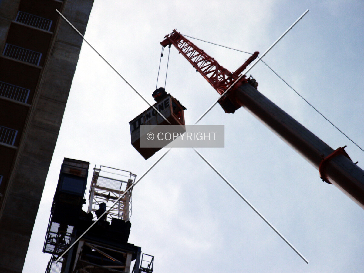 Lifting a piece off of the tower crane