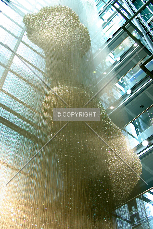 Near full-height sculpture suspended in the atrium
