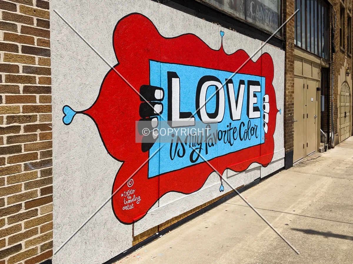 Mural on the area boarded up at the entrance from damage after a riot