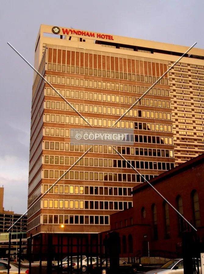 From the west on 18th Street, with the Cathedral of St. Peter and Paul reflected and the Wyndham Hotel in the background