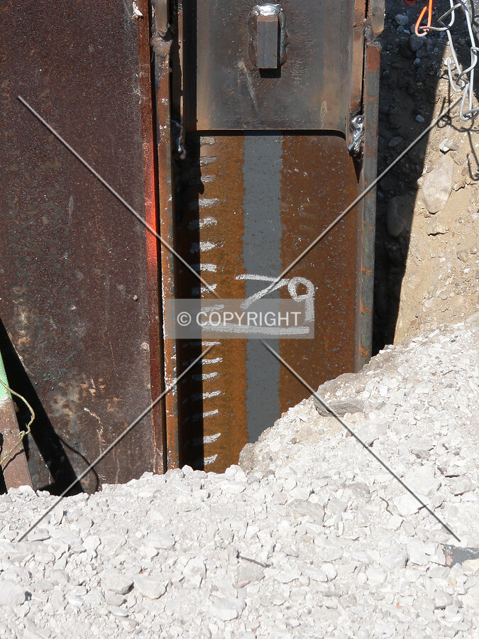 A view of a steel pile with depth markings