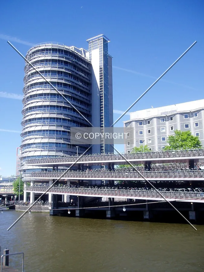 From the southeast, with nearby bicycle parking structure and the Hotel Ibis