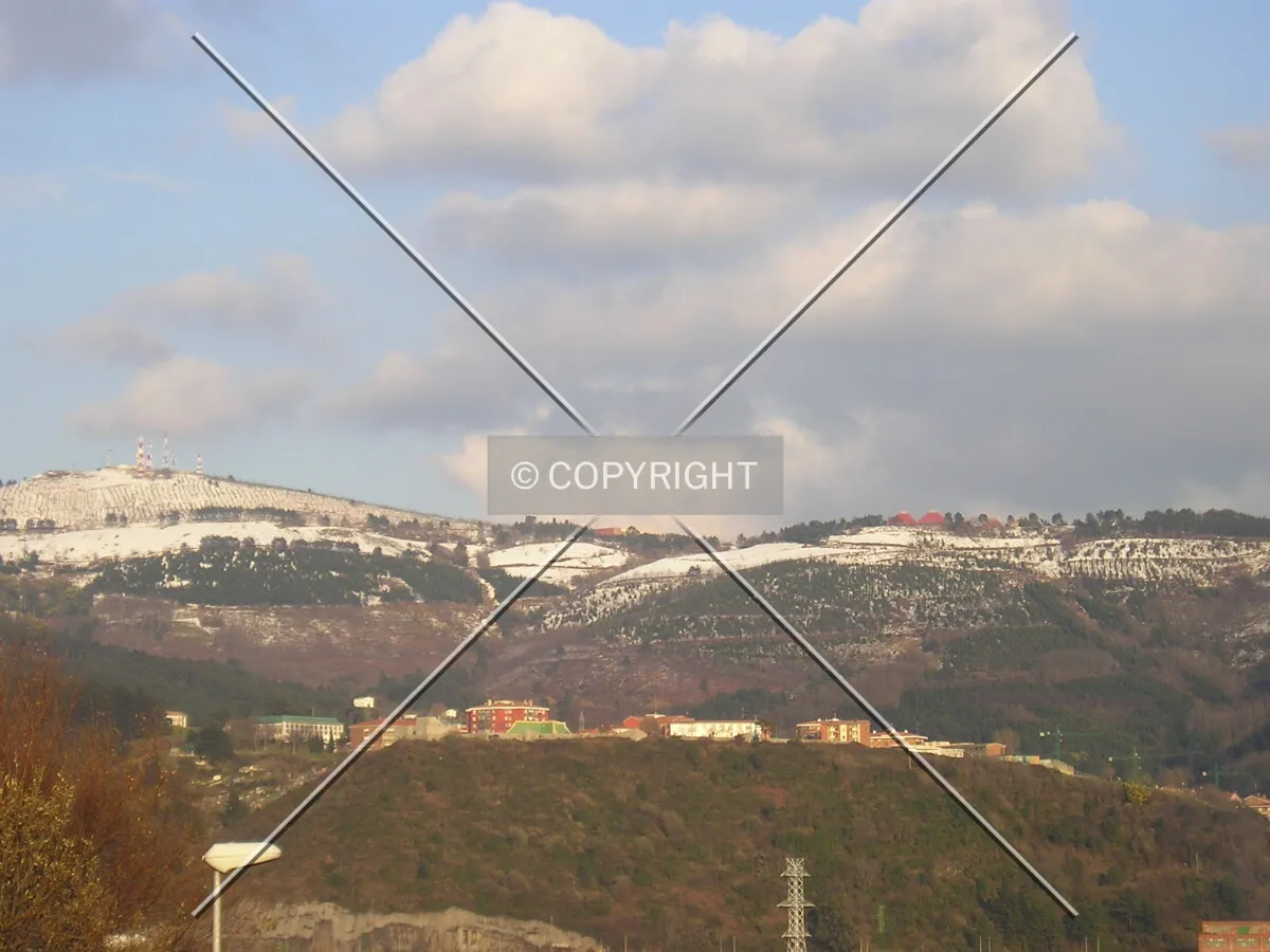 View of Etxebarri's higher elevations with snow-capped mountains