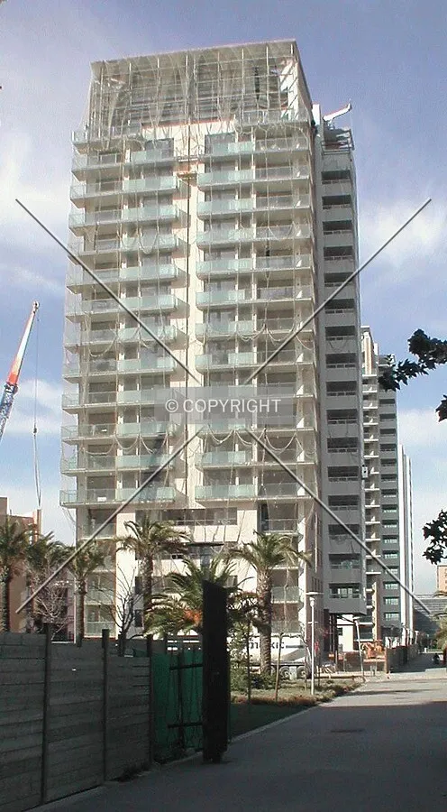 View of the facade, protected by a net to avoid accidents