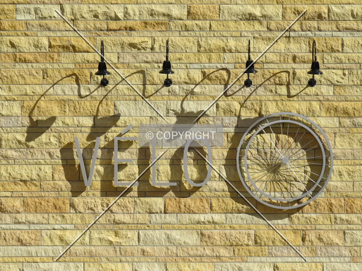 Signage and shadows on the Kasota stone facade