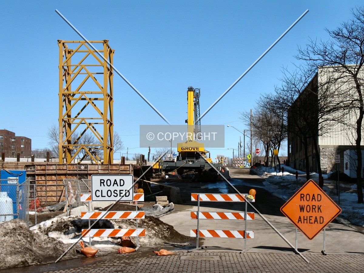 A closed 3rd Avenue SE, and the base of the tower crane, yet to be erected
