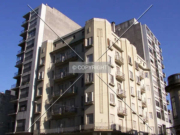 View from the southeast, wrapped around a low-rise building