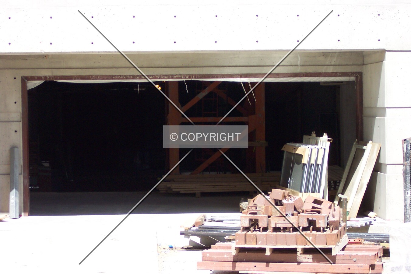 The base of the crane, currently inside the entrance of the parking garage