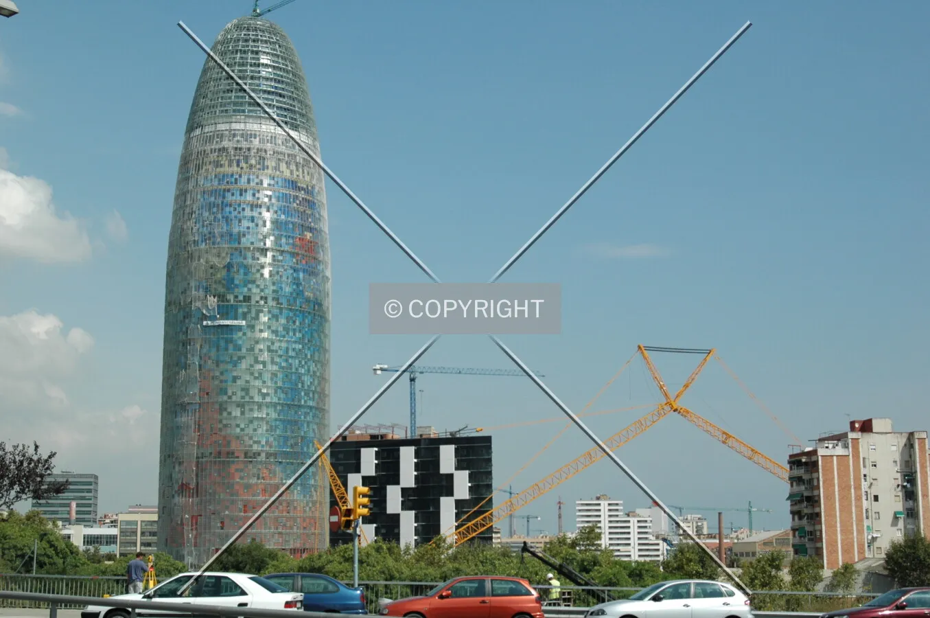 Torre Agbar and the new crane rising