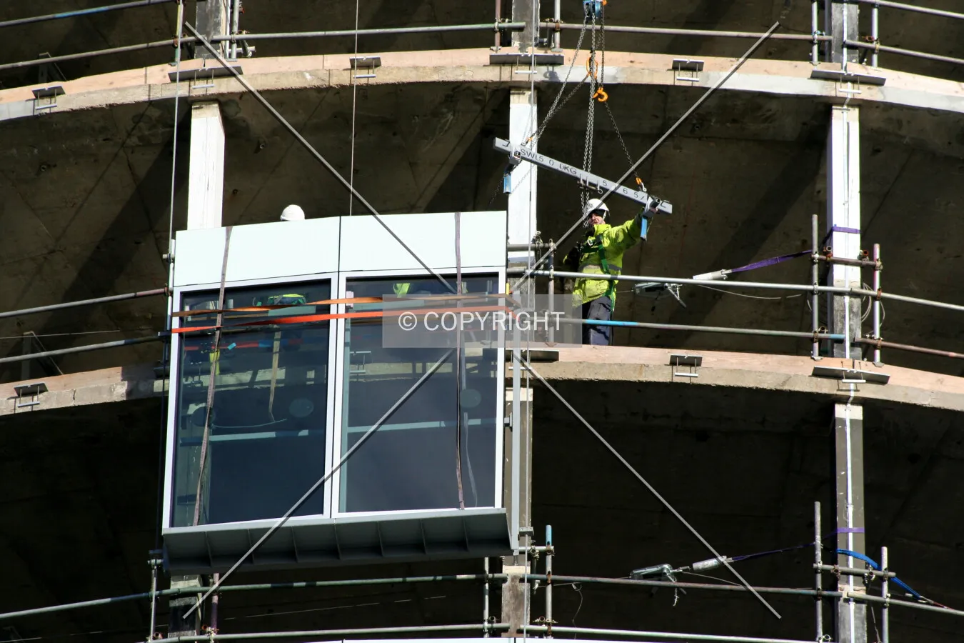 Looking up at facade installation from Smallbrook Queensway