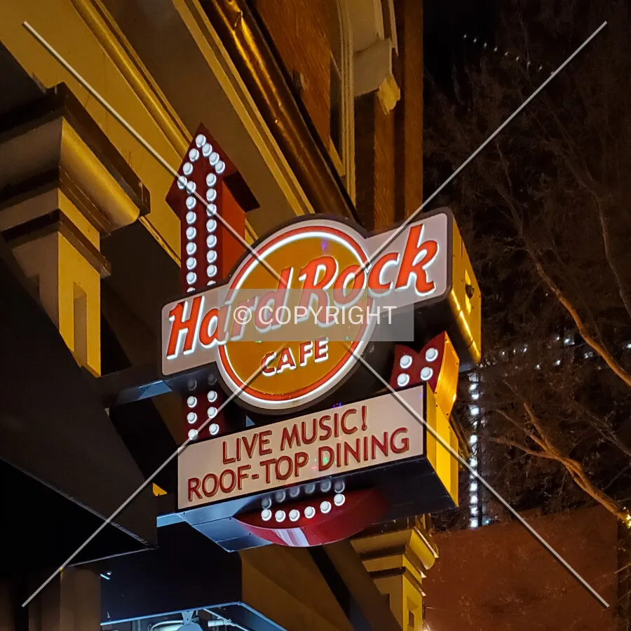 Sign above the main entrance at night; December 25, 2021