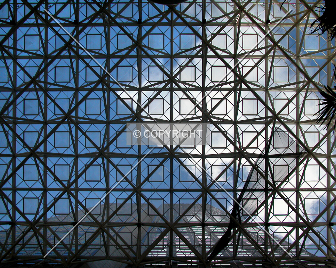 View through the west entrance plaza, with the building in lower portion of the image