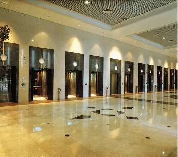 In the main lobby, 11 deluxe elevators are aligned in a row.