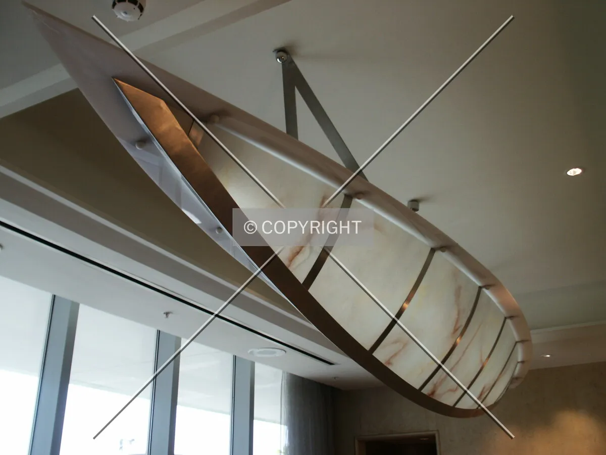 Elliptical lighting fixture on dining room ceiling in the hotel restaurant