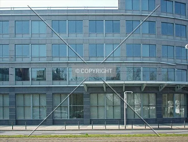 Facade at ground level between low-rise section and tower