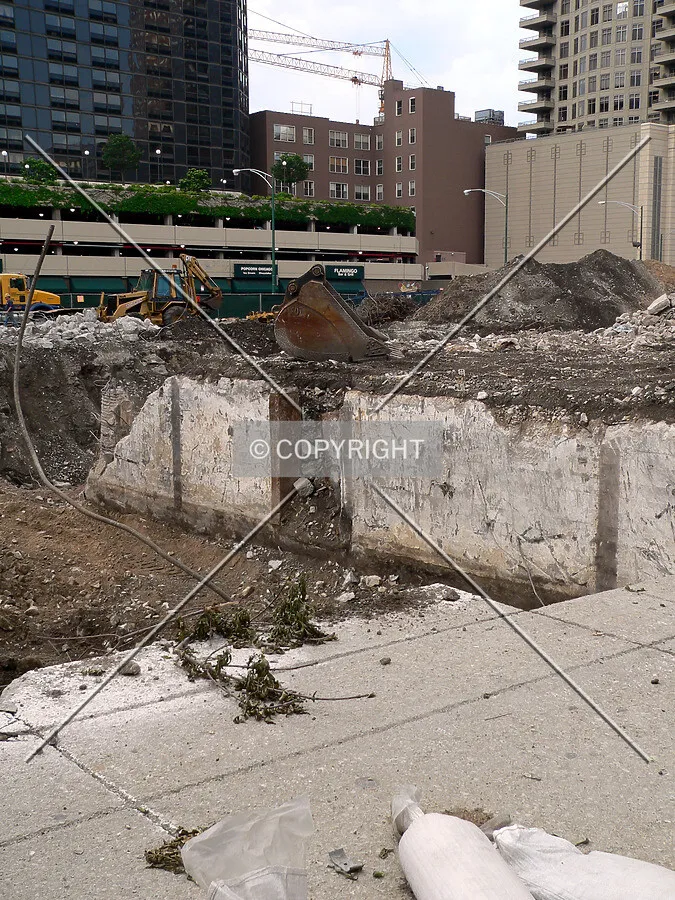 Foundation walls of the old Kraft Building visible