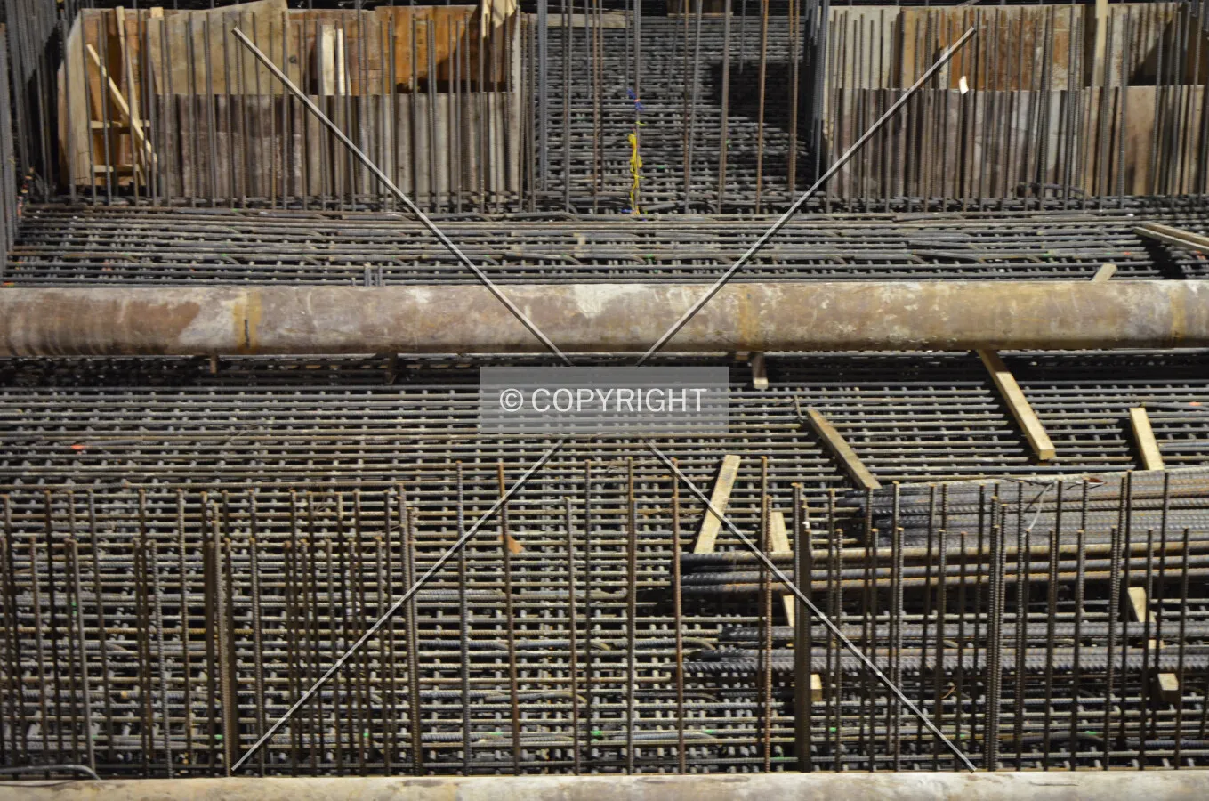 A temporary raker beam and rebar in the foundation mat shortly before the concrete pour begins; February 13, 2015.
